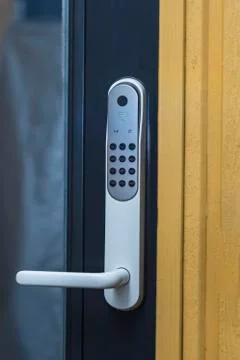 Close up view of an electric combination lock on a white door. Interior design. Stock Photos