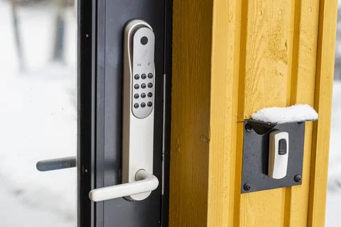 Close up view of an electric combination lock on a black door. Interior design. Stock Photos