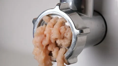 Close up view on Electric meat grinder. Making minced meat in an electric meat Stock Footage 204145143