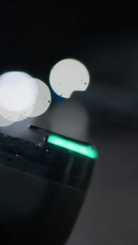 Close View of Electric Scooter Handle with Soft Bokeh Effects at Night Vidéo 310333974