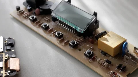 Close-up view of electronic circuit board with display and buttons Video stock 312197943