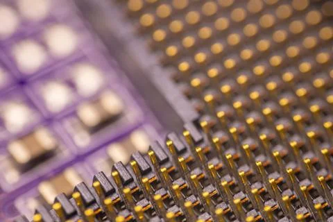 Close-up view of electronic circuit board with intricate patterns of gold-p.. Stock Photos