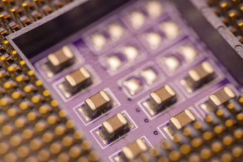 Close-up view of electronic circuit board with multiple surface-mounted com.. Stock Photos