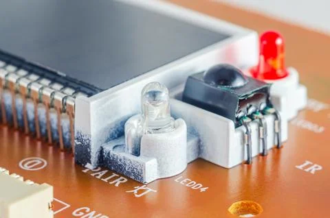 Close-up view of electronic components on a circuit board with LEDs and an .. Stock Photos