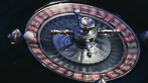 Close up View of an Elegant Casino Roulette Wheel Spinning with Ball Vídeos de archivo 344680815
