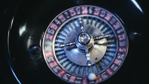 Close up View of an Elegant Casino Roulette Wheel Spinning with Ball Vídeos de archivo 344680938