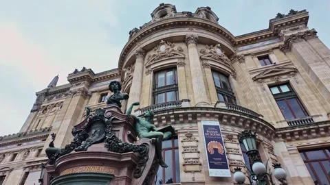 Close-up view of the elegant historic Palais Garnier building with ornate Stock Footage 303117085