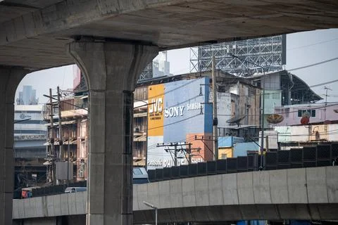 Close view of elevated road beside old buildings Photos