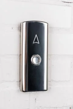 Close up view of elevator button up direction on white wall Stockfoto's