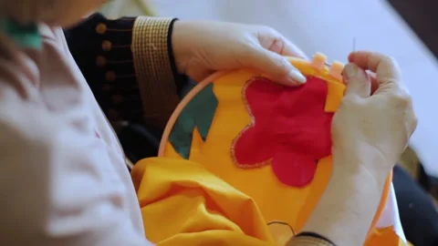 Close up view of embroidery process. Hands of female doing embroidery on fa.. Stock Footage 269158570