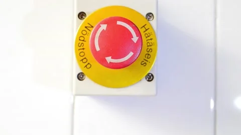 Close up view of a emergency stop button and a hand hitting it Stock Footage 55325816