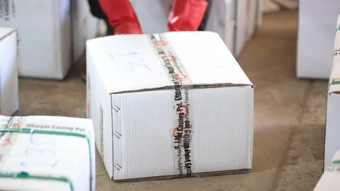 Close view of employee taping on the box for the dispatch. Video stock 302984652