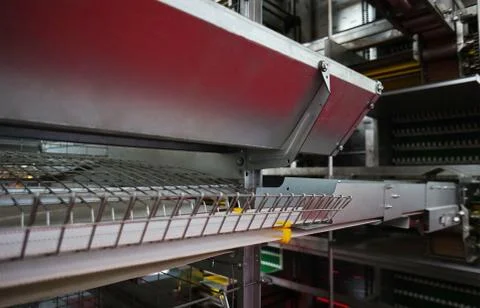 Close-up view  of empty caged rearing equipment in Chicken Farm. Stock Photos