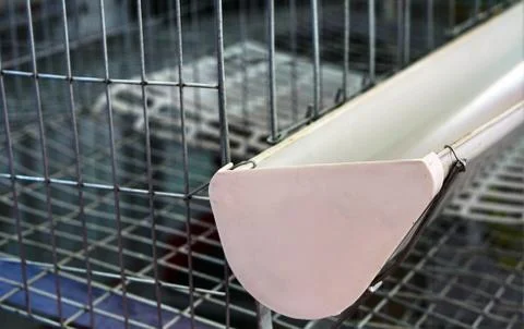 Close-up view  of empty caged rearing equipment in Chicken Farm. Stock Photos