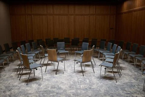 Close-up view of empty chairs arranged in a circle for a group therapy sessio Stock Photos