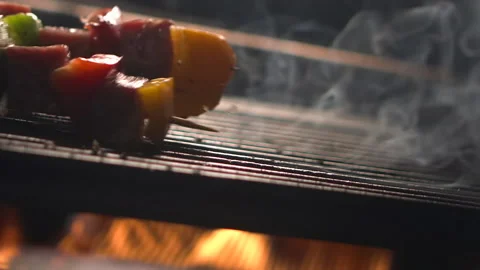 Close-up view of an empty hot charcoal barbecue BBQ grill with some fire Stock Footage 157842930