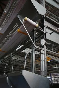 Close-up view of empty metal mesh caged equipment in poultry farm Фото