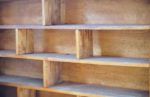 Close-up view of an empty multi-tiered handmade wooden shelf with natural grain Stock Photos