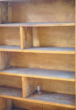 Close-up view of an empty multi-tiered handmade wooden shelf with natural grain Stock Photos