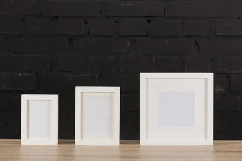 Close up view of empty photo frames on wooden tabletop Foto stock