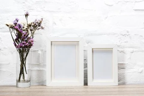 Close up view of empty photo frames and flowers in vase 写真素材