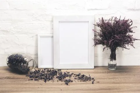 Close up view of empty photo frames and lavender flowers on wooden table 写真素材
