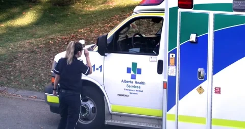 A Close-up view of an EMS ambulance with first responder paramedics. Stock-Footage 252476090