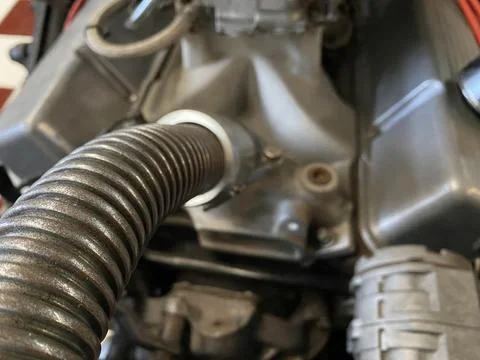 Close up view of the engine and electrical parts of a car. Stock Photos