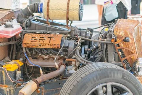 A close-up view of the engine and part of the wheel on a vehicle shows a we.. 写真素材