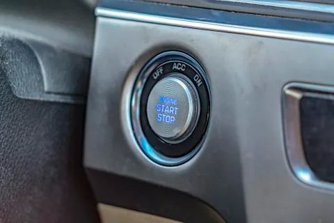 Close up view of an engine push start and stop button inside a vehicle 스톡 사진