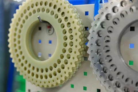 Close view of engineering parts displayed on wall in a workshop environment.. 写真素材