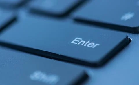 Close up view of enter key on a computer keyboard keys Stock Photos