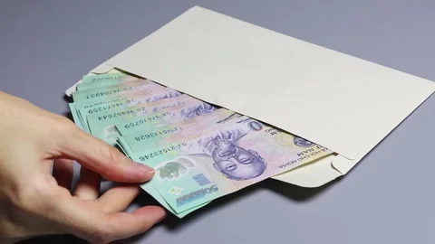 Close up view of the envelope with Vietnamese dong (VND) banknotes Stock Footage 304693536
