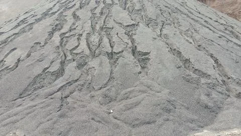Close Up View of Eroded Sand and Gravel Stockpile Hill with Erosion Channels Stock Photos