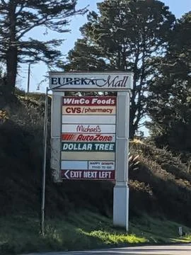 Close view of the Eureka Mall sign listing WinCo Foods, CVS Pharmacy Photos