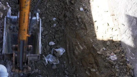 Up close view of excavator digging into the ground Stock Footage 121456027