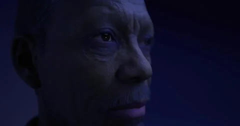 Close up view of an expressive humanoid figure in dim lighting atmosphere Stock Illustration