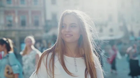 Close up view of extremely attractive blue-eyed young Caucasian woman walking Stock Footage 112673718