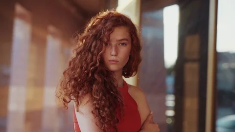Close up view of extremely beautiful ginger curly student girl in attractive red Video stock 115669468