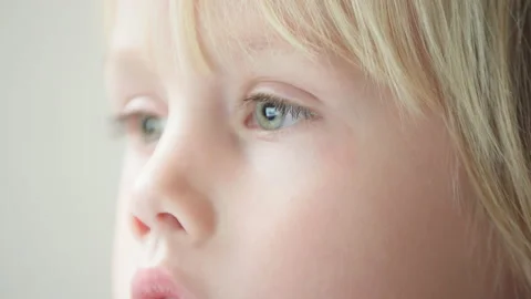 Close view of eyes of boy looking at laptop that is reflected in eyes' apples Video stock 224526404
