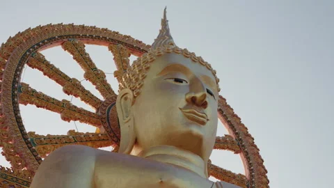 Close up view face and arm of giant sitting golden buddha in Koh Samui island in Stock Footage 250177966