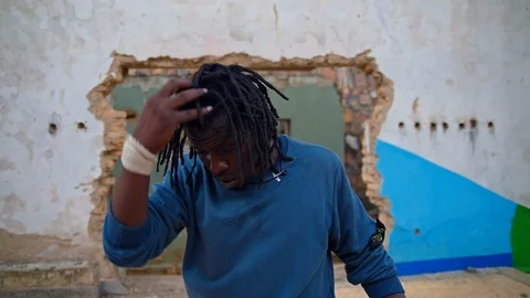 Close up view face of an athletic man with dread hair Stock Footage 117696016