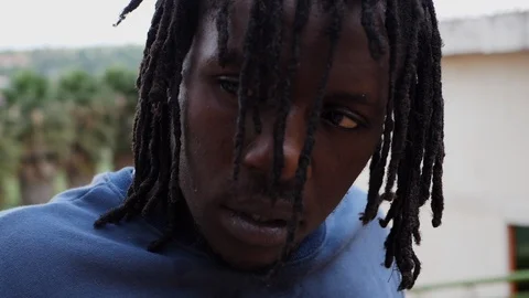 Close up view face of athletic parkour guy pausing  Stock Footage 117620411