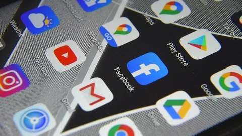 Close-up view of Facebook icon app on an Android smartphone, including other  Stock Footage 127710881