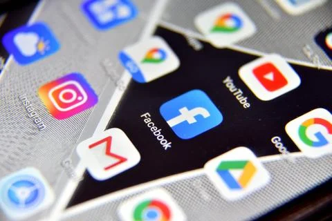 Close-up view of Facebook icon app on an Android smartphone, including other  Фото