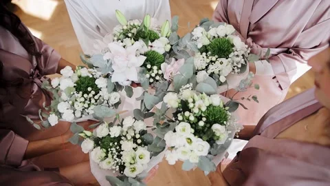 Close up view of faceless bridesmaids holding wedding bouquet with white roses Stock Footage 204123915