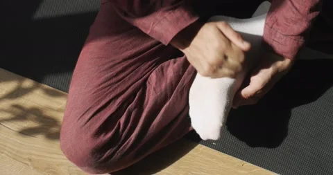 Close up view of faceless masseur warming up foot muscles slow motion sunny Stock Footage 140704942
