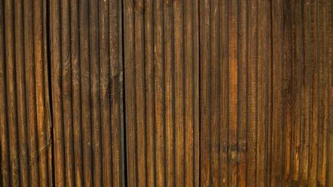 Close-up view featuring parallel dark brown wooden slats, creating a textured Stock Photos