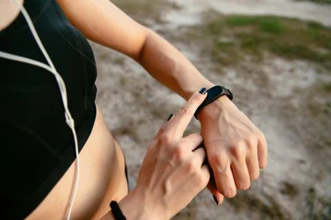 Close-up view of female checking the time on her watches Stock Photos