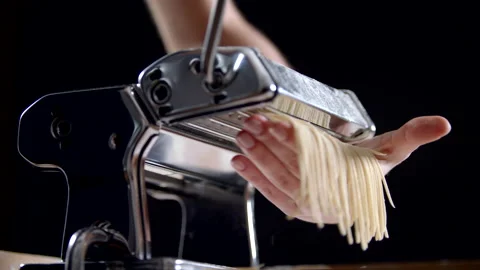 Close Up View Of Female Chef Makes Pasta Using Steel Cutting Machine Stock Footage 170241873